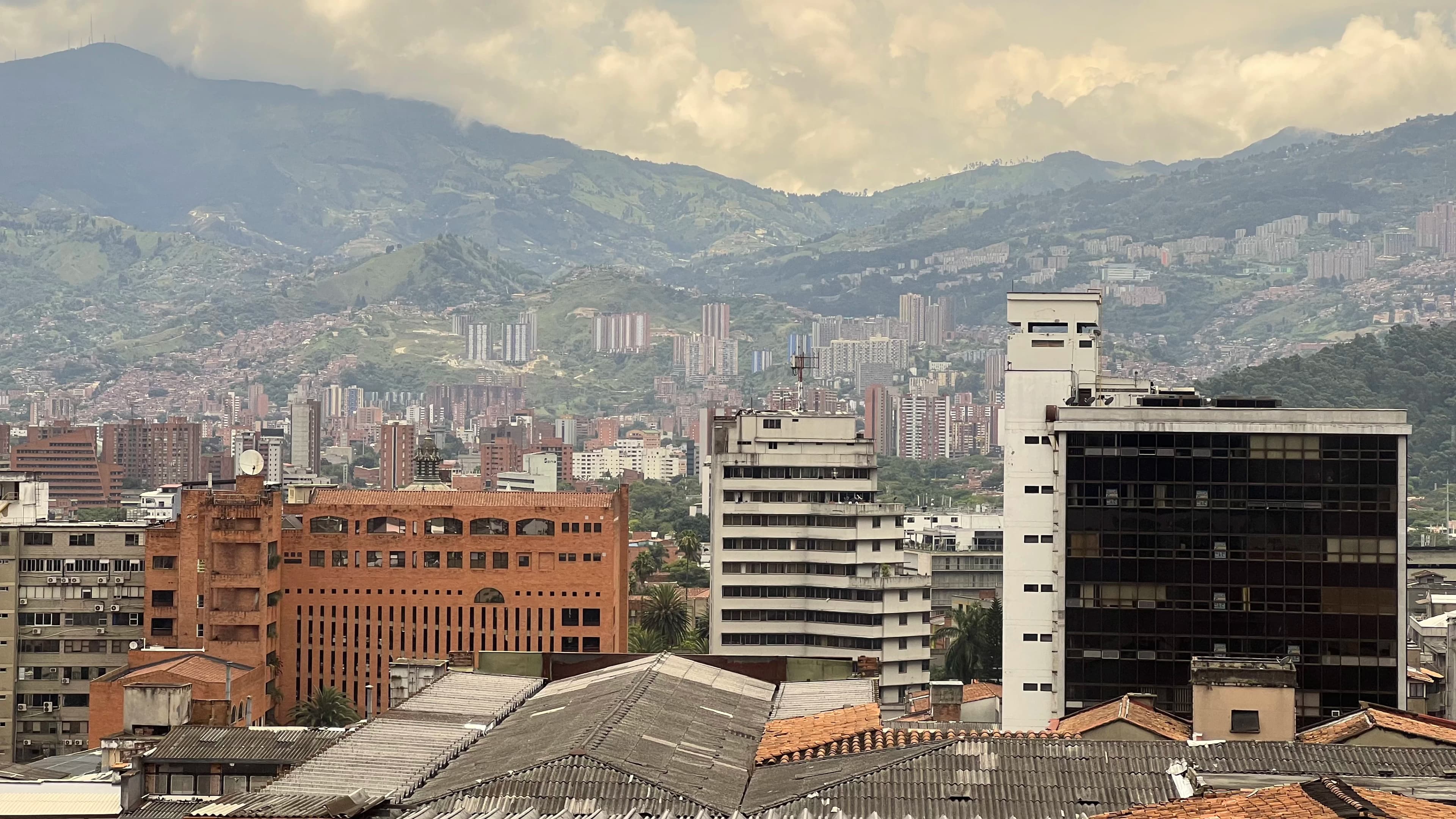 a city with mountains in the background