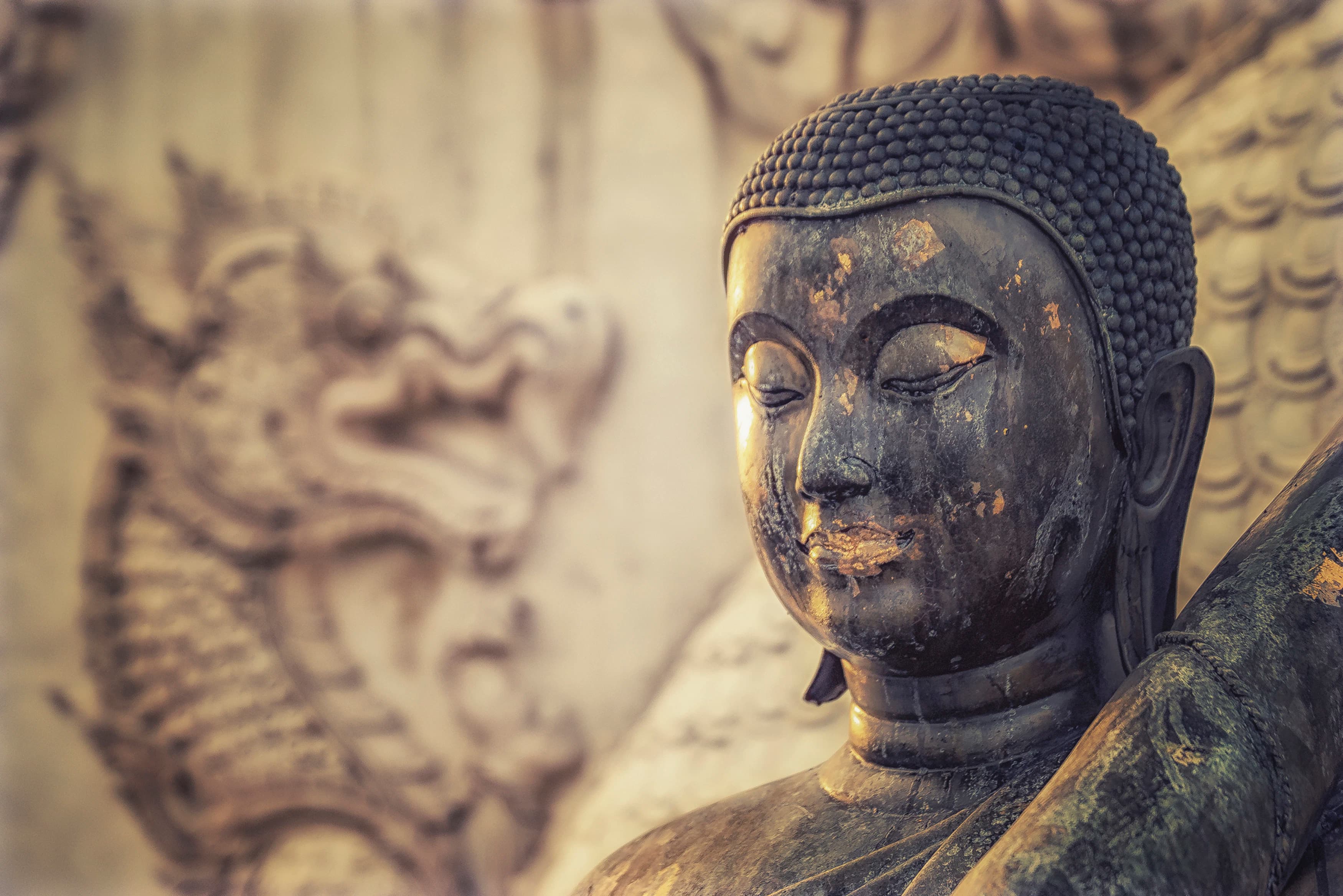 black and gold buddha statue