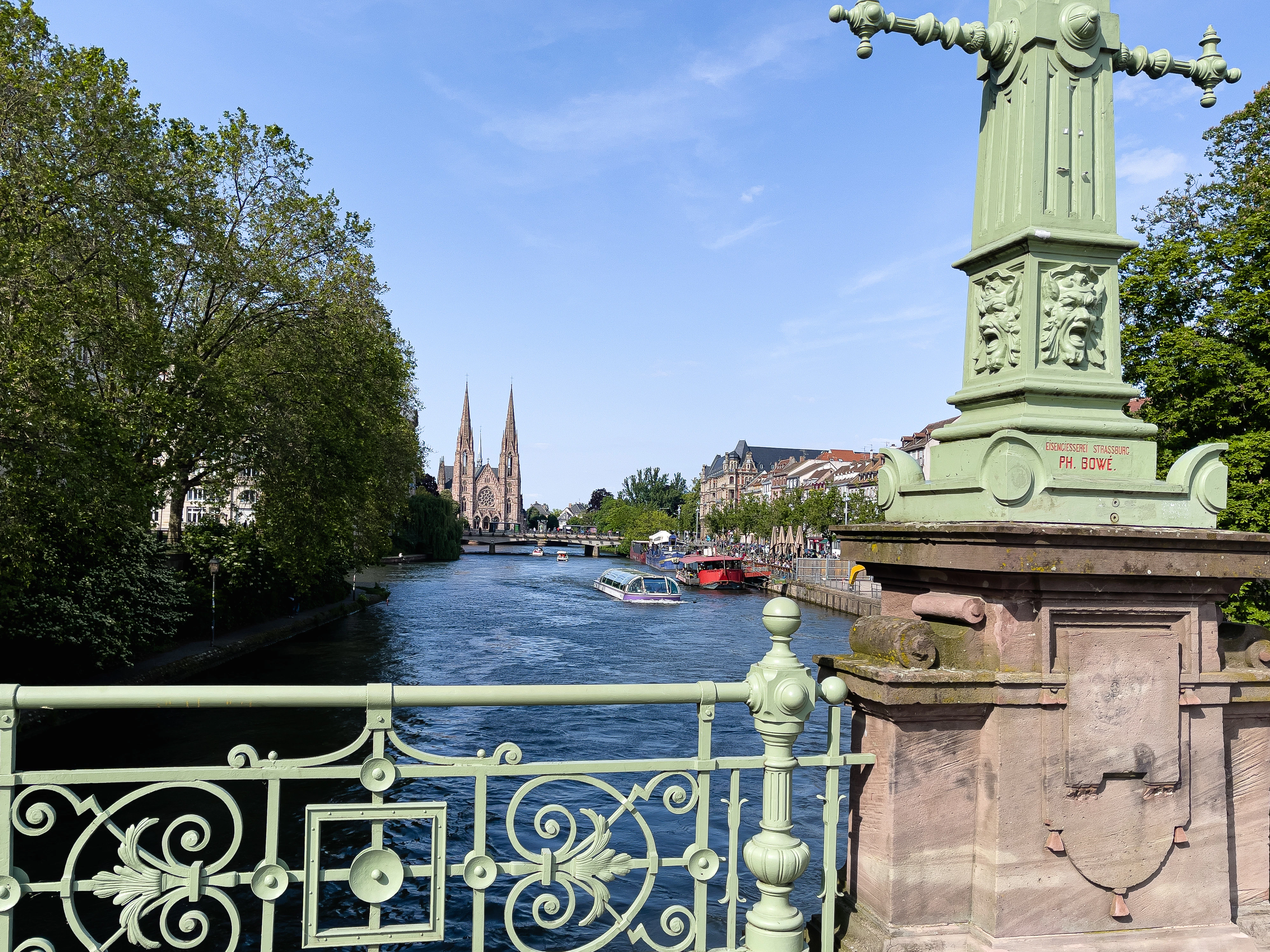 a statue on a bridge over a river