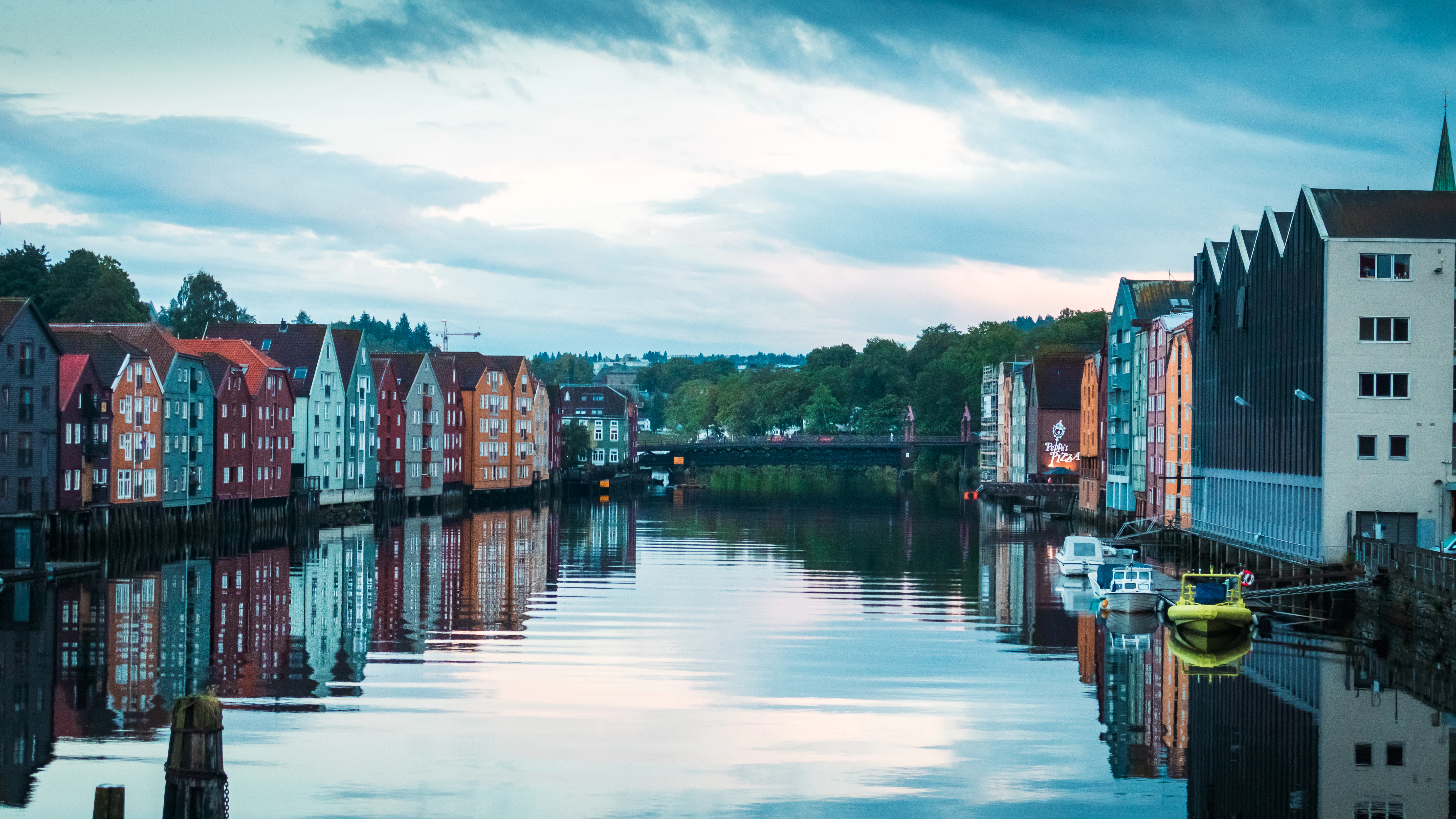 A body of water with a bunch of buildings in the background