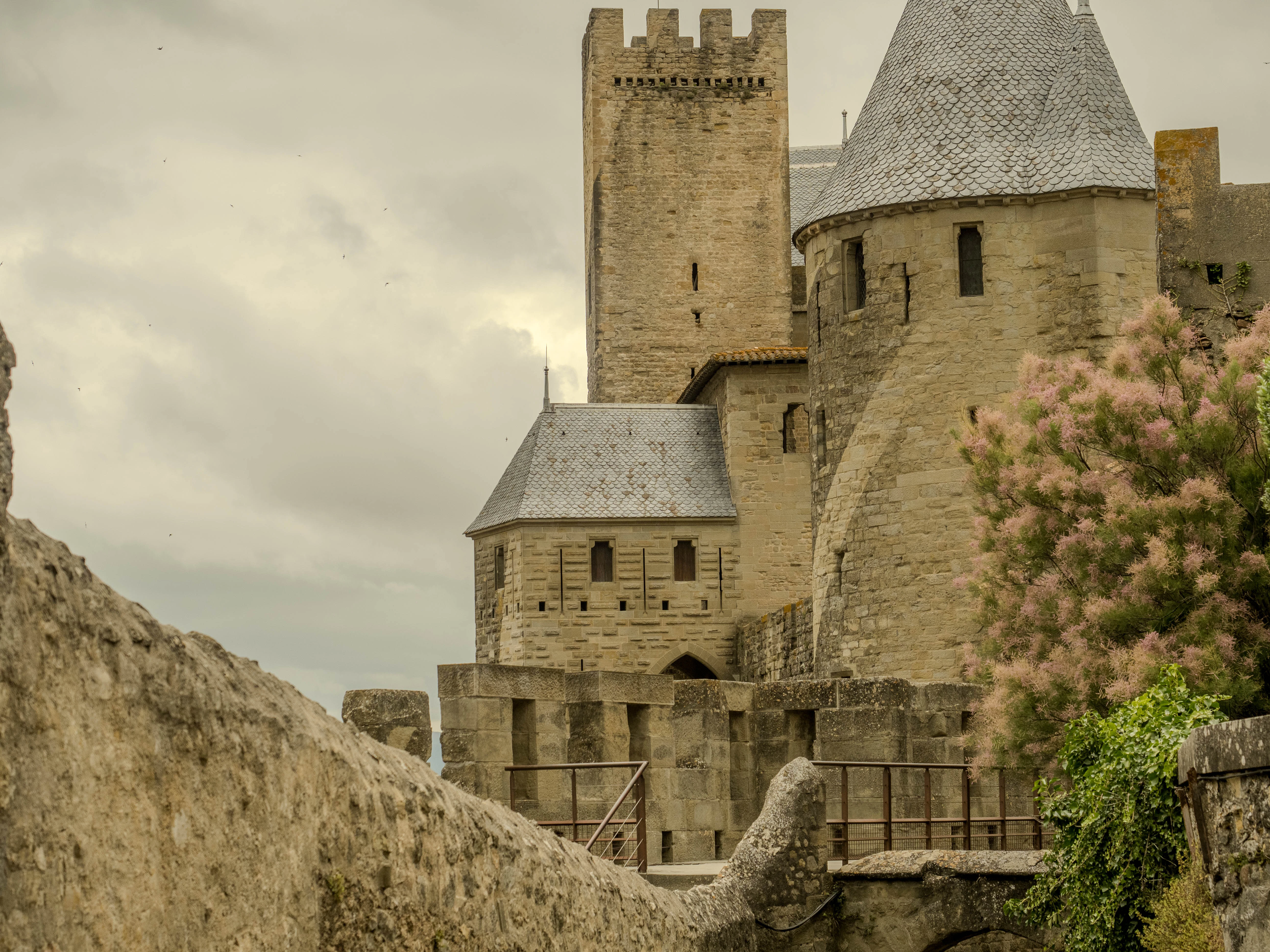 An old castle with a bridge going through it
