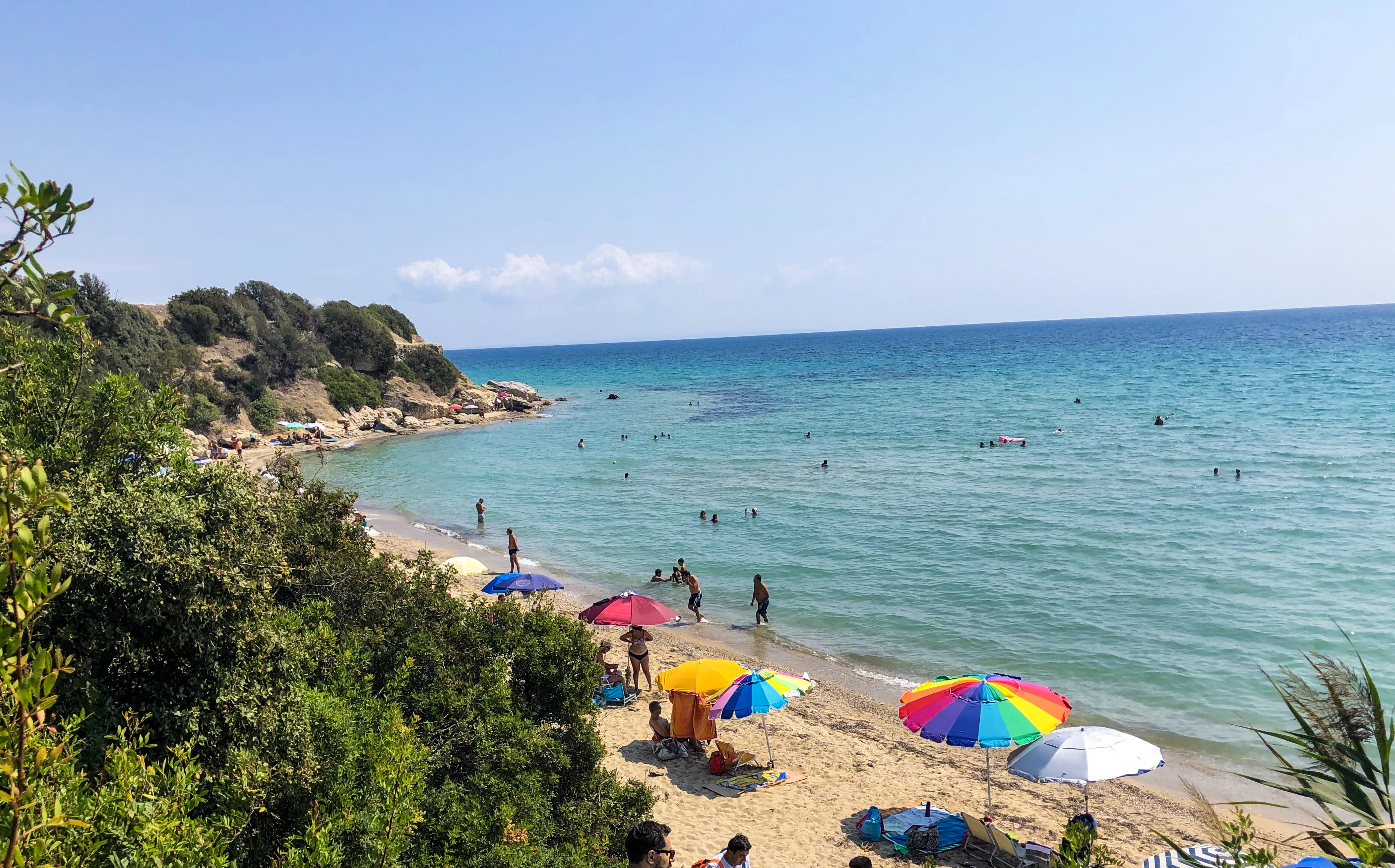 patio umbrellas on shore at daytime