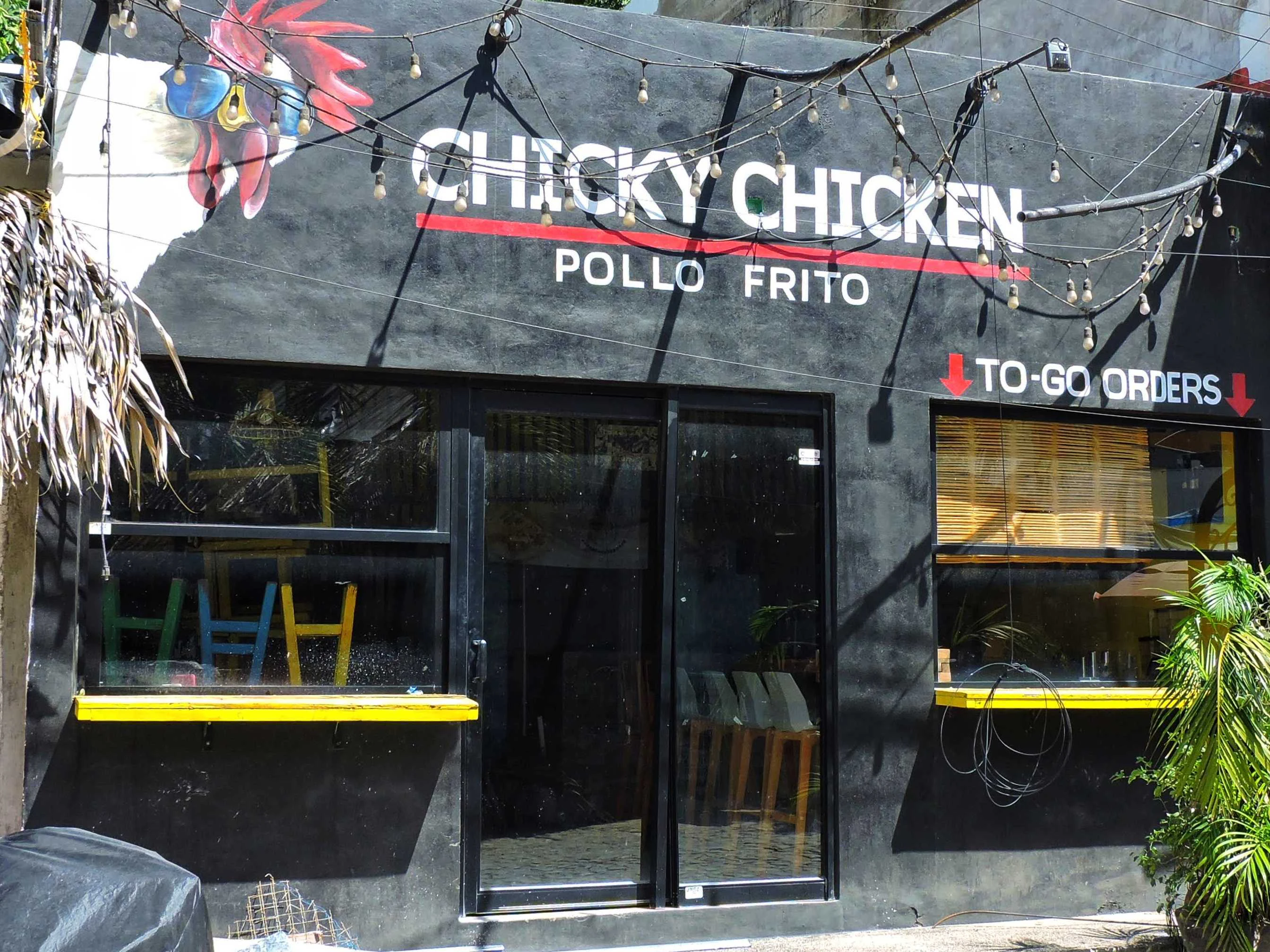 A restaurant called chicky chicken in a city