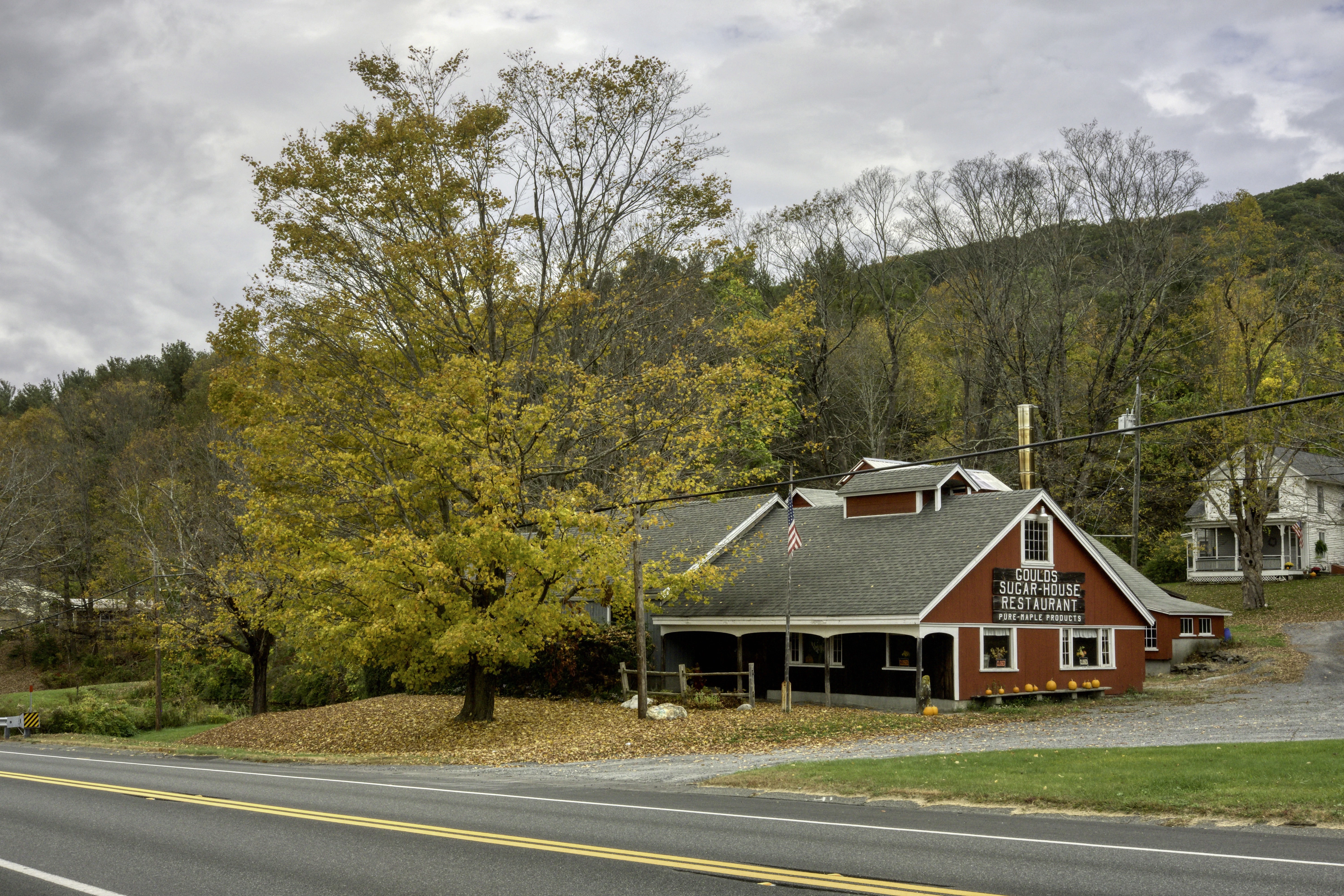 a red building sitting on the side of a road