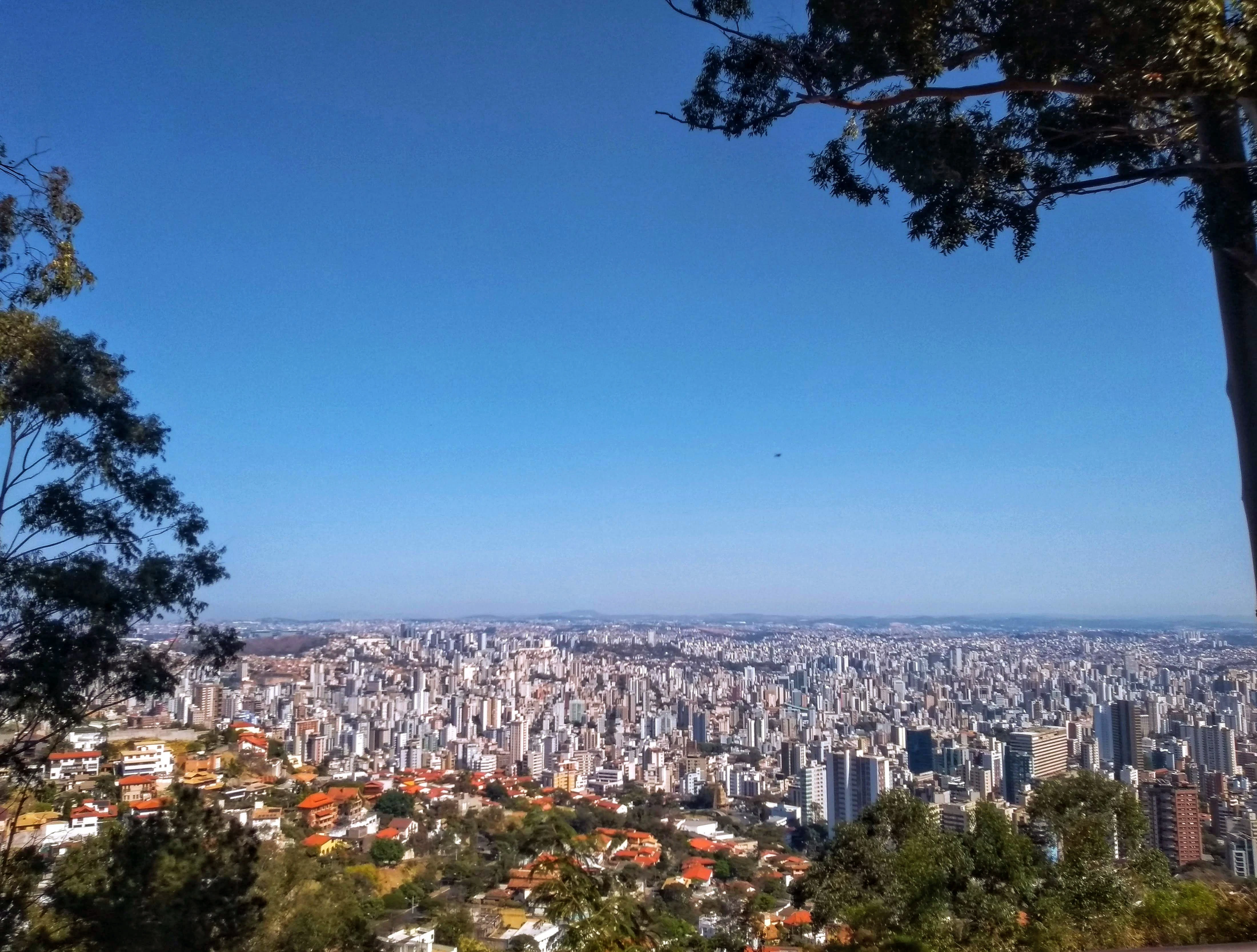 a view of a city from the top of a hill
