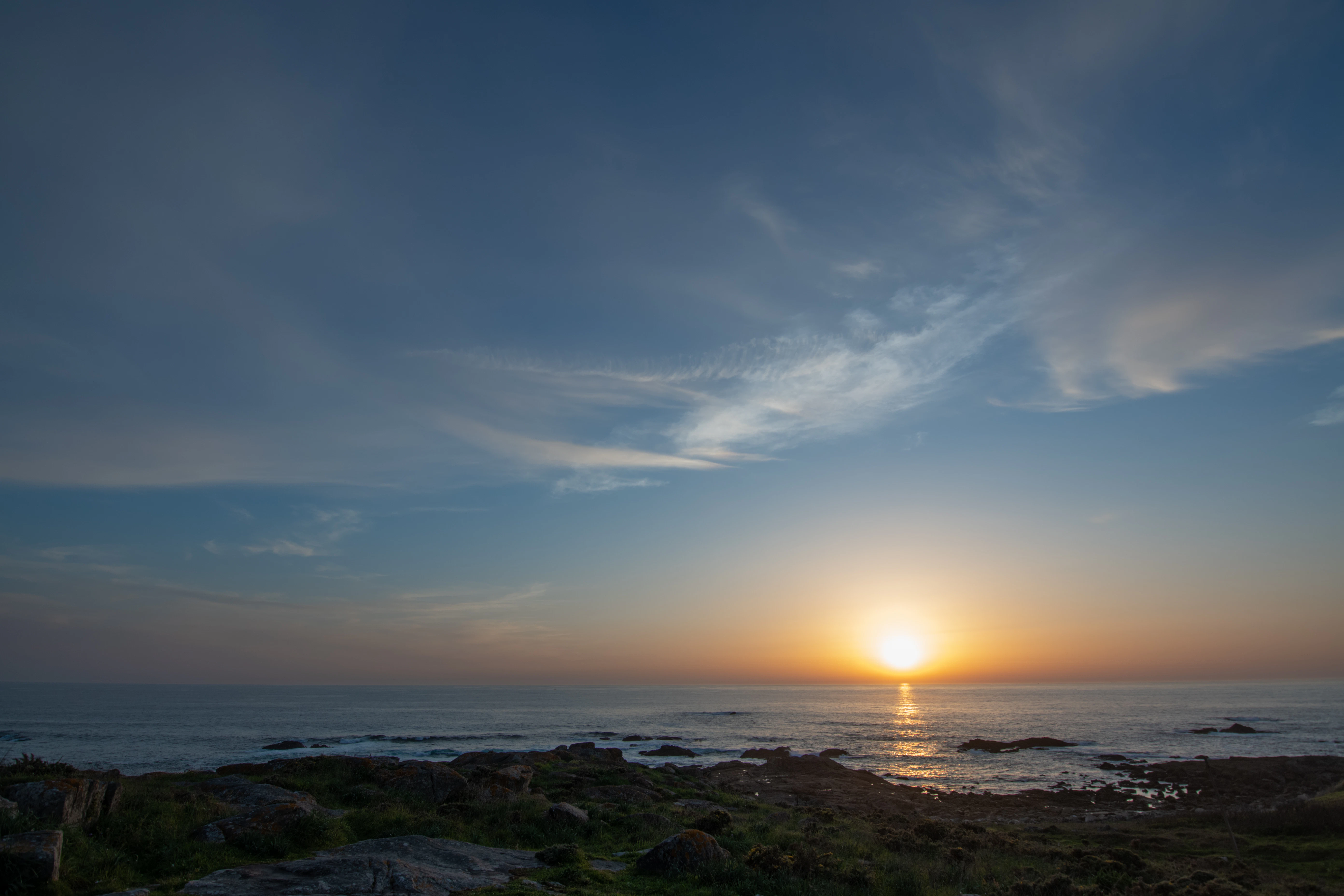 Sunset over the ocean with beautiful clouds.