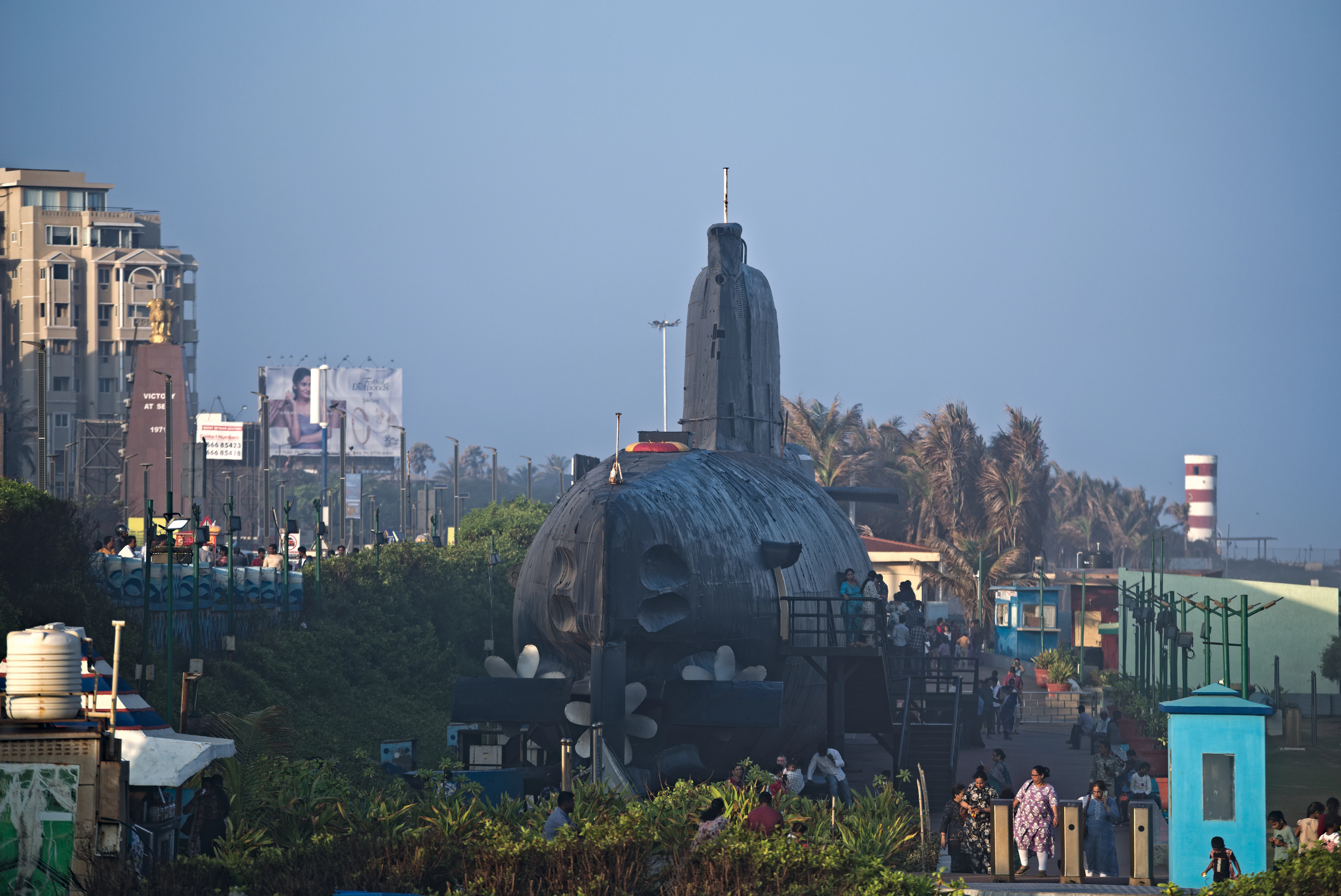 Submarine displayed near coastal buildings and trees