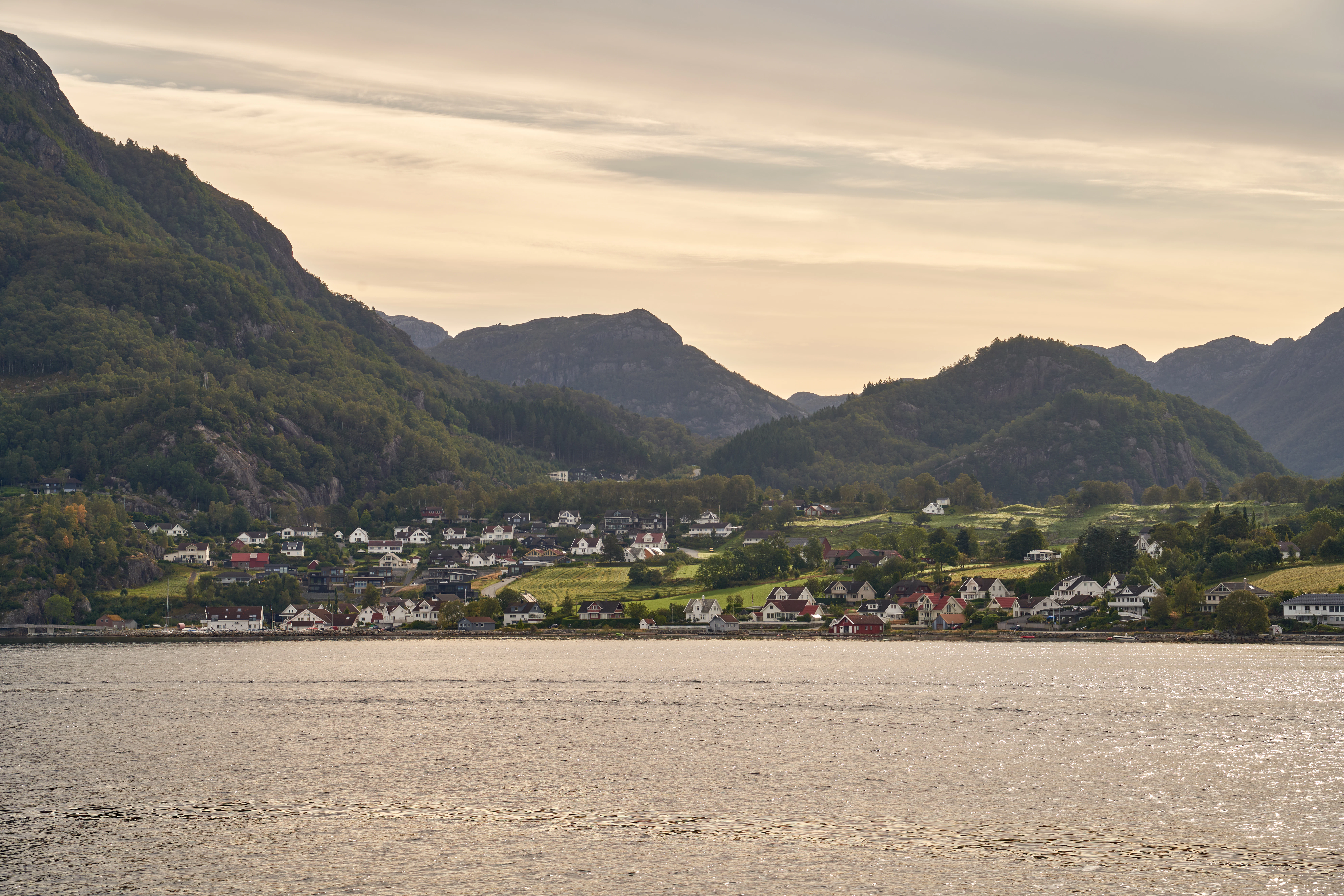 Coastal village nestled at the foot of mountains